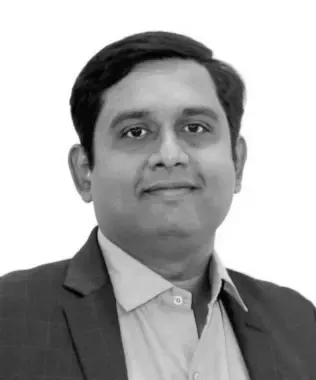 Black and white portrait of a woman with long blonde hair, looking forward.