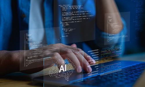Person typing on laptop with holographic AI interface showing code and data.