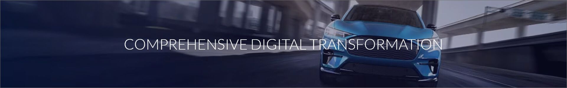 Futuristic vehicle with blue accents on a dark road, displaying 'COMPREHENSIVE DIGITAL TRANSFORMATION'.